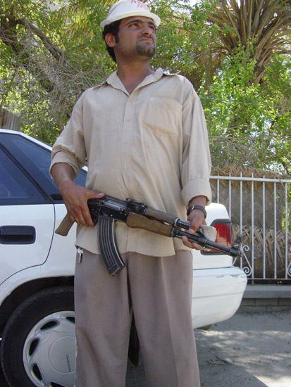 A Man Guarding His House