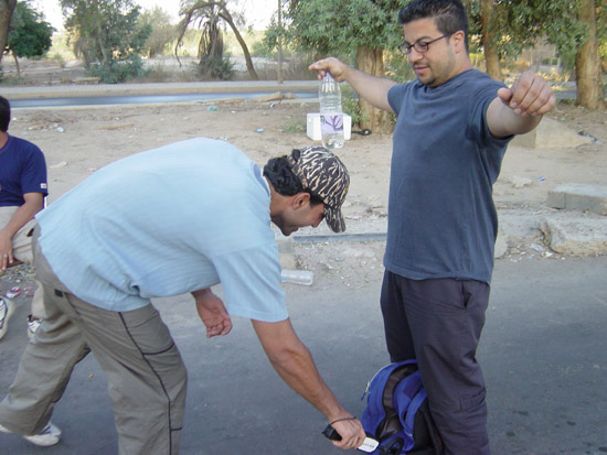 Bassam Being Searched by Civilians Hired By US Soldiers